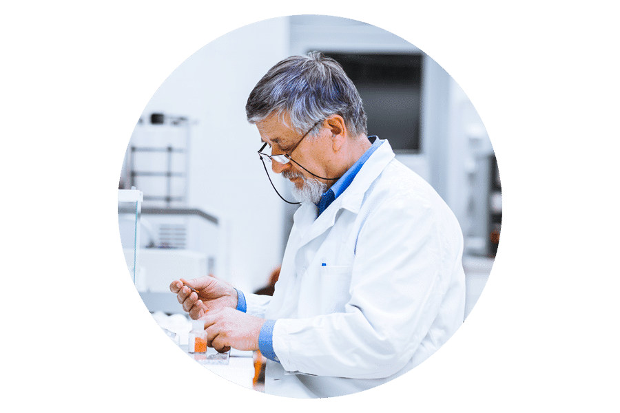 Roundel image of an older male scientists working in a labAccelerate discovery - photo of scientist looking down